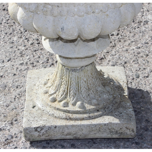 327 - A pair of decorative stone or concrete garden planters with plants, each approx 37cm in diameter x 4... 