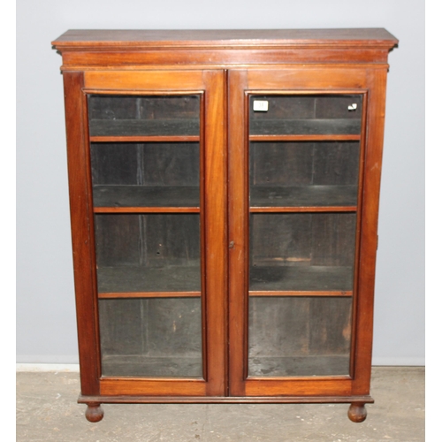 38 - Victorian glazed mahogany bookcase on bun feet, approx 96cm wide x 28cm deep x 123cm tall