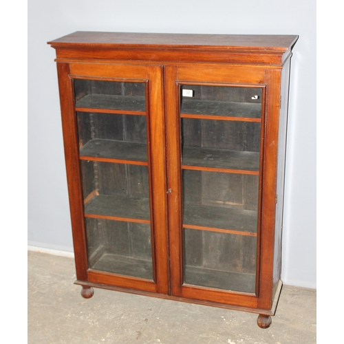 38 - Victorian glazed mahogany bookcase on bun feet, approx 96cm wide x 28cm deep x 123cm tall