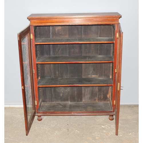 38 - Victorian glazed mahogany bookcase on bun feet, approx 96cm wide x 28cm deep x 123cm tall