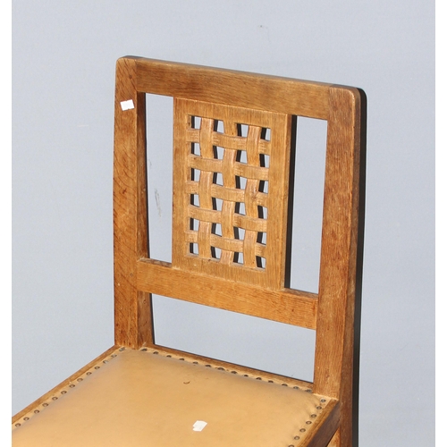 42 - Robert 'Mouseman' Thompson - A set of 4 Oak lattice backed dining chairs, with studded leather seats... 