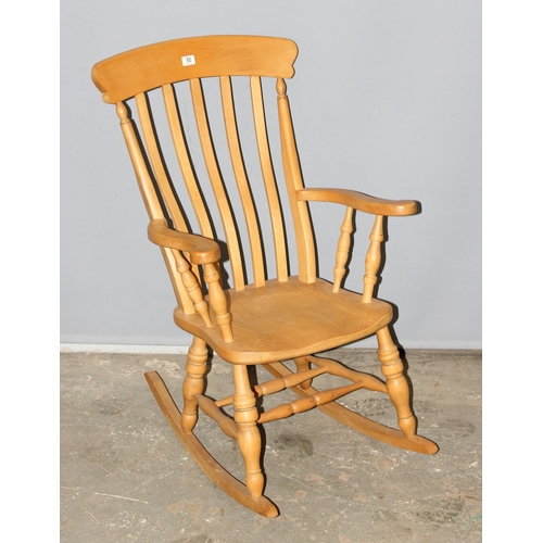 50 - A beech slatback farmhouse rocking chair