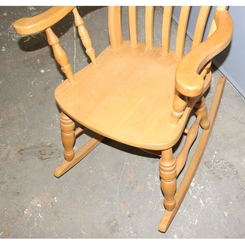 50 - A beech slatback farmhouse rocking chair