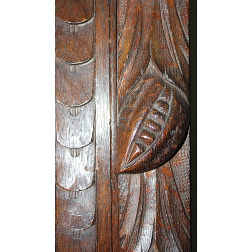 64 - An interesting highly decorative 17th century style carved oak bookcase cupboard with single drawer,... 