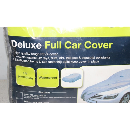 706 - Qty of car related magazines and a universal car cover 483cm x 178cm x 120cm