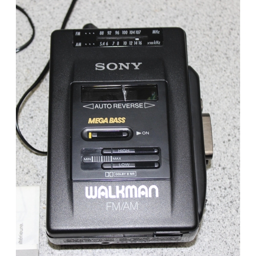 756 - Sony Walkman Cassette FM/AM WM-F2068 with earphones and instruction manual