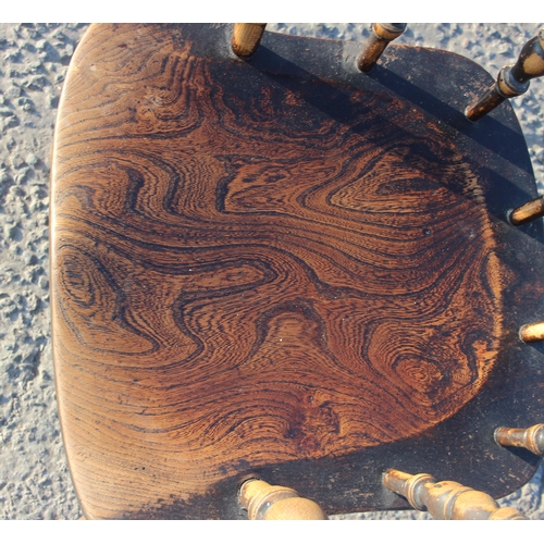 81 - A vintage oak or elm seated smokers bow or captain's armchair, likely early 20th century, approx 62c... 