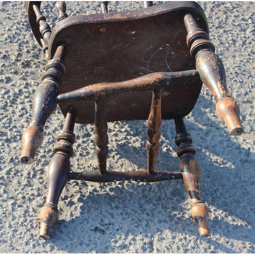 81 - A vintage oak or elm seated smokers bow or captain's armchair, likely early 20th century, approx 62c... 