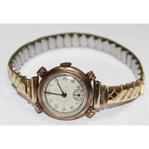 1327 - A 9ct gold cased watch with expanding gold plated strap, marked for Edinburgh 1943, approx 20.43g gr... 