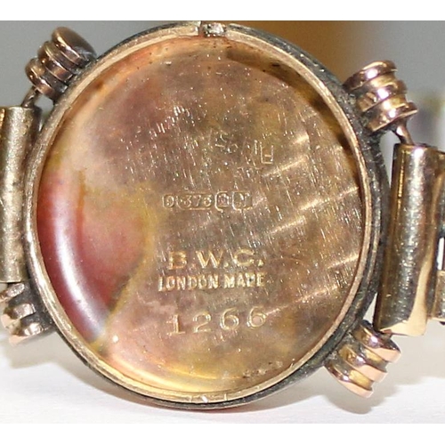 1327 - A 9ct gold cased watch with expanding gold plated strap, marked for Edinburgh 1943, approx 20.43g gr... 