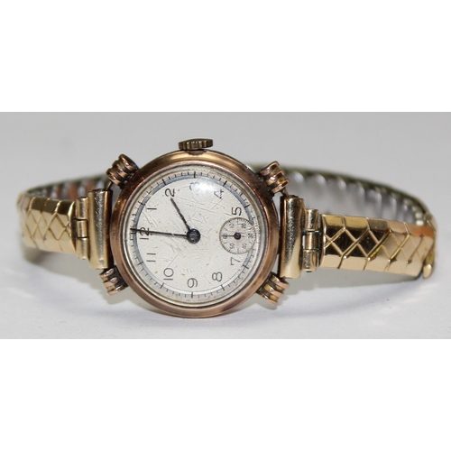 1327 - A 9ct gold cased watch with expanding gold plated strap, marked for Edinburgh 1943, approx 20.43g gr... 