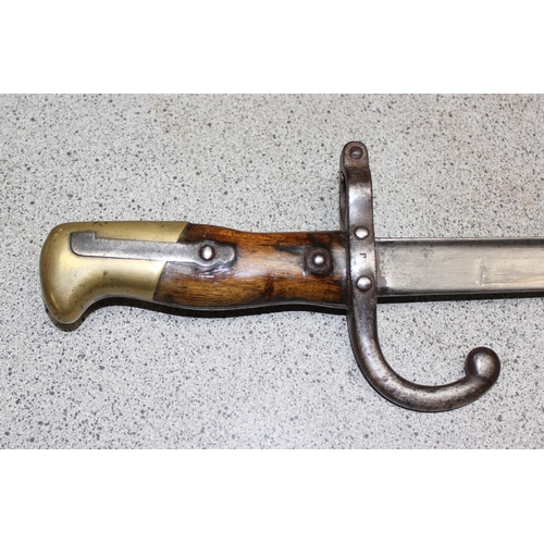 1401 - A French model 1874 bayonet and scabbard, dated 1877