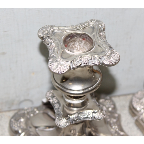 1053 - Pair of English silver-plated candle sticks with grapevine decoration, approx 14cm tall