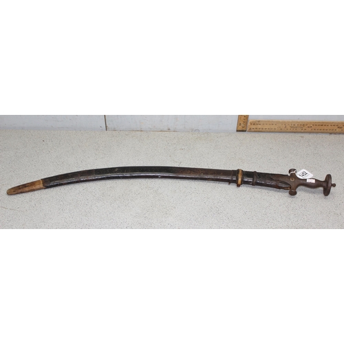 1452 - Indian Tulwar sword in scabbard, likely 19th century, blade approx 75cm long