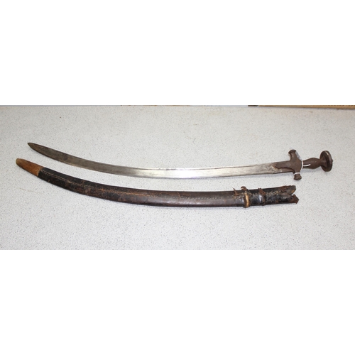 1452 - Indian Tulwar sword in scabbard, likely 19th century, blade approx 75cm long