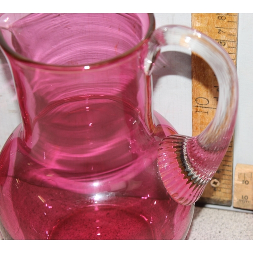 1633 - Cranberry glass pitcher and 6 wine glasses