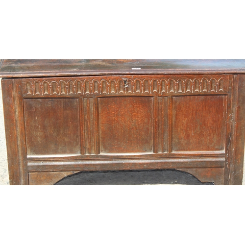 119 - An 18th century oak coffer with panelled and carved details, approx 115cm wide x 48cm deep x 64cm ta... 