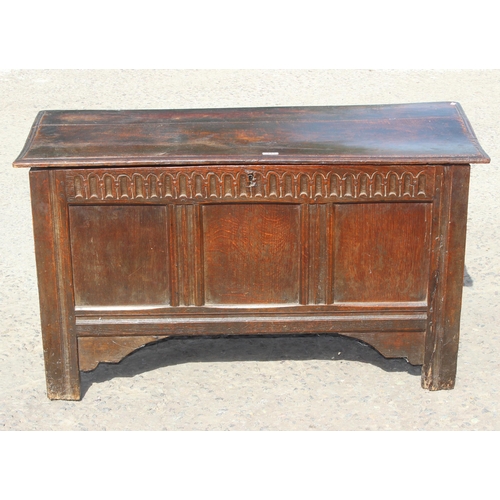 119 - An 18th century oak coffer with panelled and carved details, approx 115cm wide x 48cm deep x 64cm ta... 