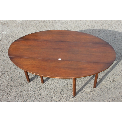 120 - An antique mahogany Irish wake table, likely late 18th or early 19th century, the extra-long oval ta... 