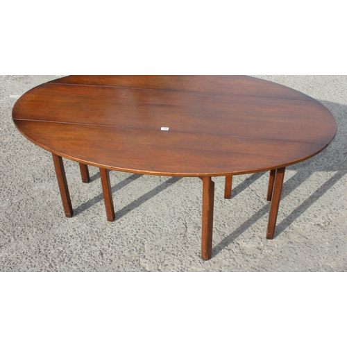 120 - An antique mahogany Irish wake table, likely late 18th or early 19th century, the extra-long oval ta... 