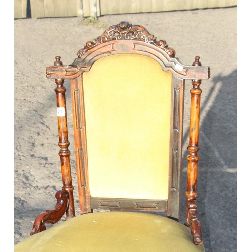 121 - A Victorian carved upholstered low chair