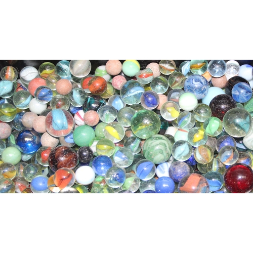 1524 - Large qty of glass and other marbles in metal tin approx 9kg