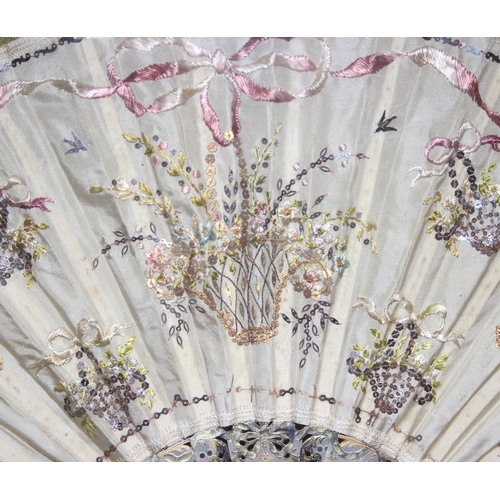 1640 - A 19th century silk embroidered fan decorated with baskets of flowers, the sticks and guard made fro... 