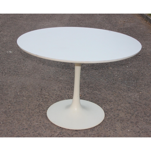 26 - A retro Arkana tulip table and 3 matching chairs, the table and the chairs all with moulded marks, t... 