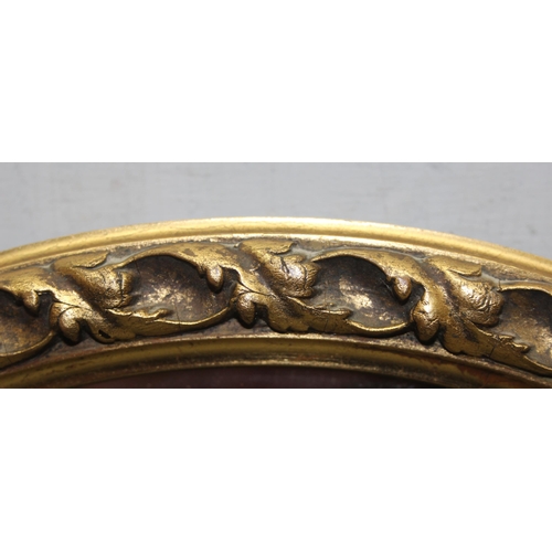 468 - Gilt framed oval wall hanging mirror with bevelled glass and oak leaf border design approx. 64cm x 5... 