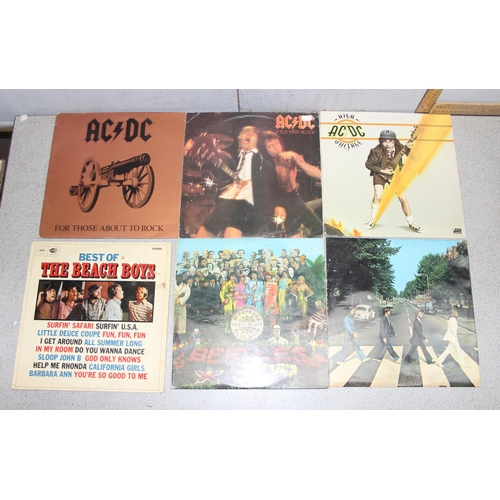 612 - Box of mixed LP vinyl records, artists A-E, to incl AC/DC, The Beach Boys, The Beatles, The Byrds, C... 