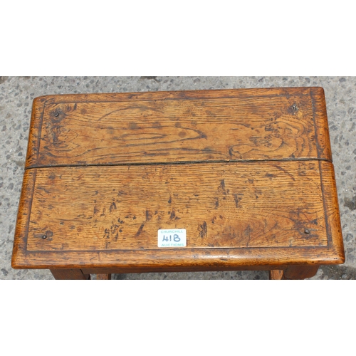 41B - An 18th century oak coffin stool standing on turned legs joined by stretchers, approx 46cm wide x 26... 