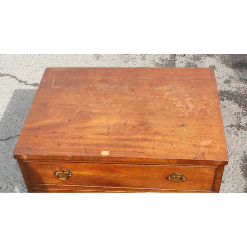 26 - An early 19th century mahogany 4-drawer chest of drawers on bracket feet with Georgian brass handles... 