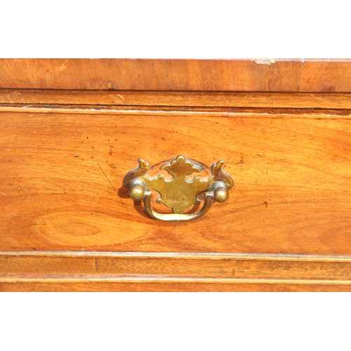 26 - An early 19th century mahogany 4-drawer chest of drawers on bracket feet with Georgian brass handles... 