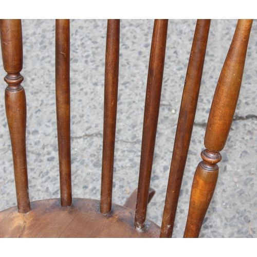 18 - Antique elm spindle-back rocking chair with penny seat, approx 95cm tall