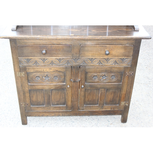 49 - Vintage dark oak dresser with 2 drawers over cupboard, approx 110cm W x 41cm D x 180cm H