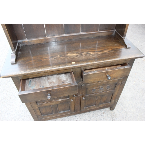 49 - Vintage dark oak dresser with 2 drawers over cupboard, approx 110cm W x 41cm D x 180cm H