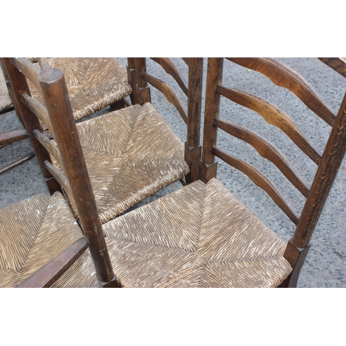 28 - A set of 6 Edwardian Arts & Crafts period ladder-backed rush-seated chairs, to incl 2 carvers, stron... 