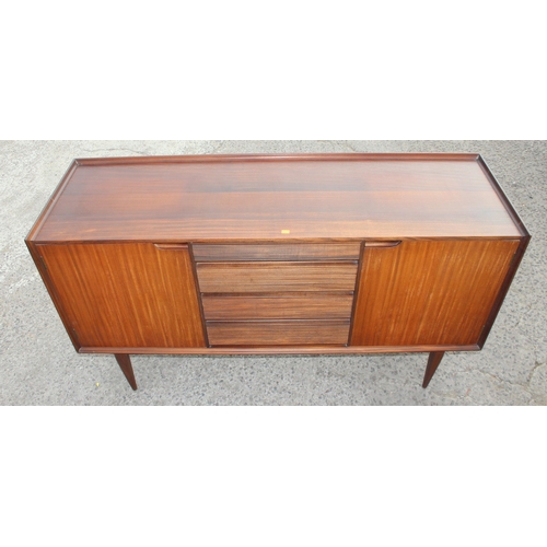 1 - A retro mid-century teak sideboard, seemingly unmarked but strongly believed to be by furniture desi... 