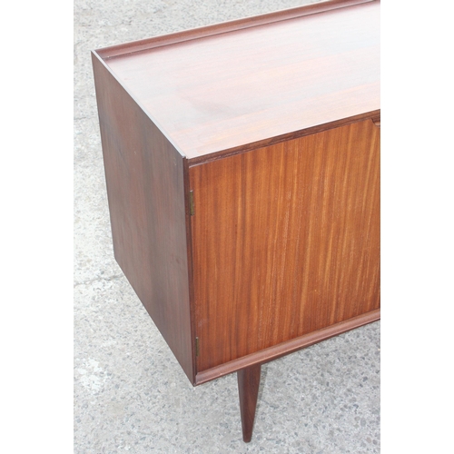 1 - A retro mid-century teak sideboard, seemingly unmarked but strongly believed to be by furniture desi... 