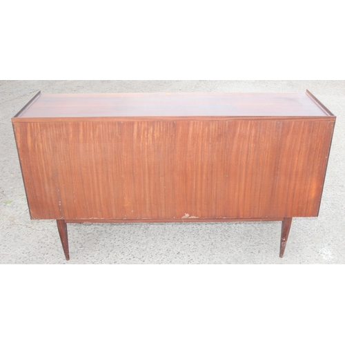 1 - A retro mid-century teak sideboard, seemingly unmarked but strongly believed to be by furniture desi... 