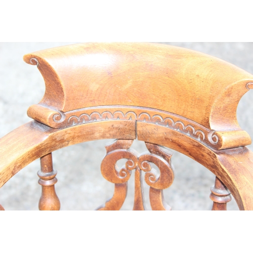 10 - Antique wooden smoker's-bow style baby's highchair with elm seat and carved details, approx height 8... 