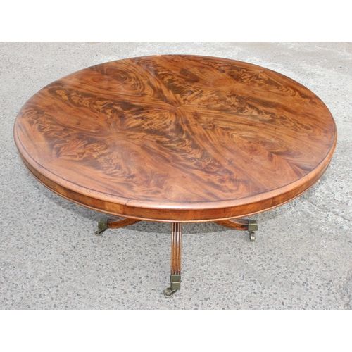 6 - Victorian mahogany tilt-top breakfast table with brass castors, approx 128cm W x 72cm H