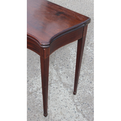 7 - A 19th century mahogany fold-out tea table with single drawer on tapered legs, approx 91cm W x 36cm ... 