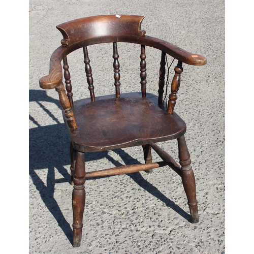 32 - Gaskell & Chambers of Birmingham, an antique elm seated smoker's bow chair, with unusual added wire/... 