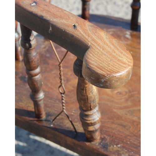 32 - Gaskell & Chambers of Birmingham, an antique elm seated smoker's bow chair, with unusual added wire/... 