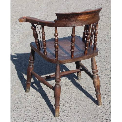 32 - Gaskell & Chambers of Birmingham, an antique elm seated smoker's bow chair, with unusual added wire/... 