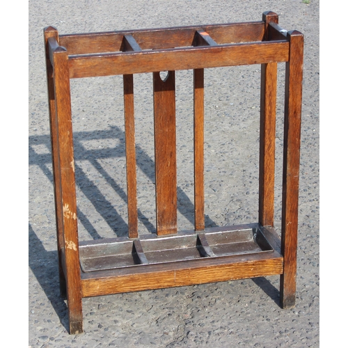 53 - Triple-compartment oak stick stand with drip tray, approx 62cm W x 24cm D x 76cm H