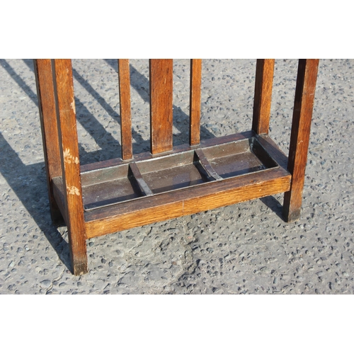 53 - Triple-compartment oak stick stand with drip tray, approx 62cm W x 24cm D x 76cm H