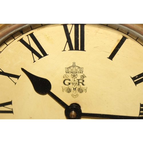 Circular mahogany cased 8 inch dial mechanical winding wall clock with key