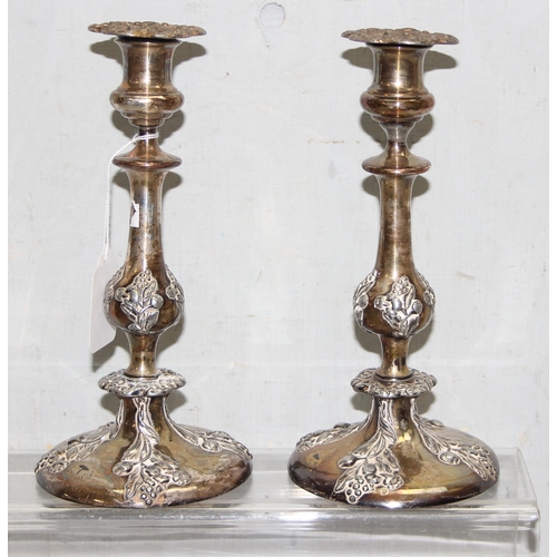 1008 - A pair of antique silver plated candlesticks, seemingly unmarked, each approx 24cm tall